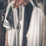 white and black clothes in a rack