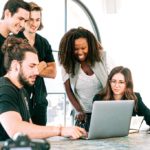 office staff in front of laptop